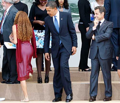President Obama checks out Brazilian woman at G8 summit.